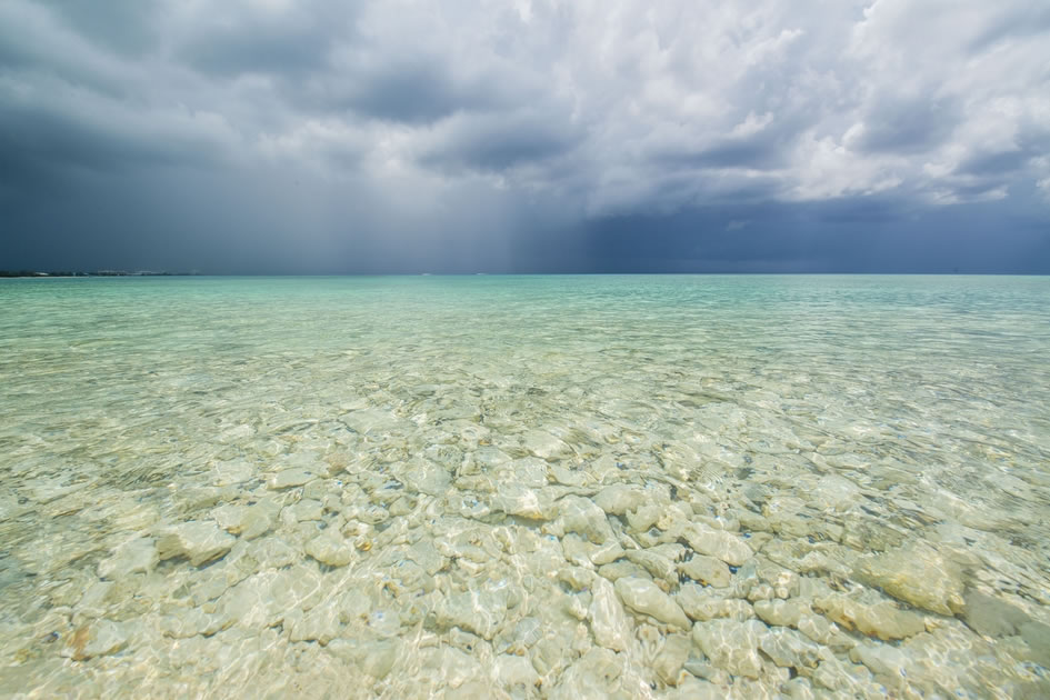 Storm over the crystal clear waters of Seven Mile Beach
