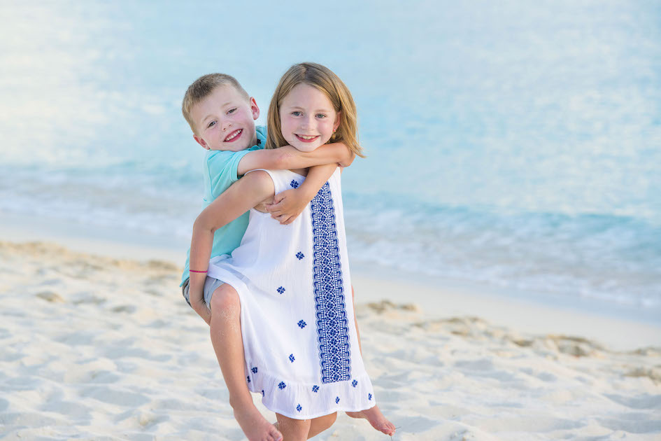 Brother and Sister on 7-Mile Beach, Cayman Islands.