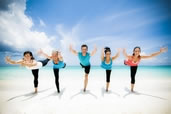 The Bliss Yoga Crew in warrior 3, Cayman Islands