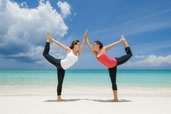 Chantelle & Rachel in double dancer, cover of Explore 2012, Cayman Islands