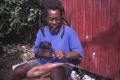 Wood carver working on creating a fish, Andros