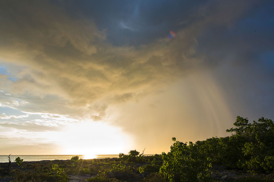 Storm front moving into Smiths Barcadere at sunset, Grand Cayman