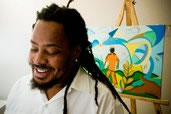 Caymanian artist Gordon Solomon with one of his paintings