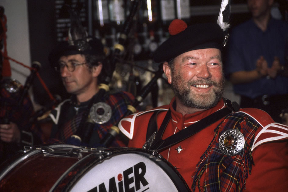 Bagpiper in a pub after a highland games, Isle of Aran