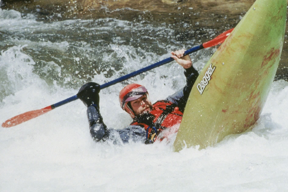 Kayaker coming out of the hole in Pine Creek