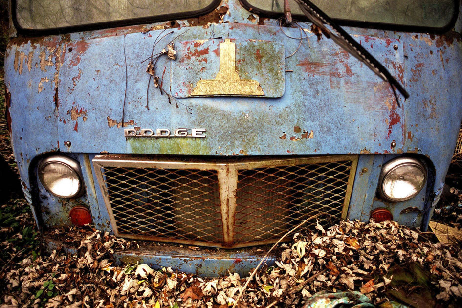 A once loved, now abandoned, Dodge Van in the forest, Athens