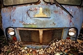 A once loved, now abandoned, Dodge Van in the forest, Athens