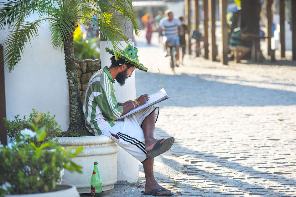 An artist paints the scene on the main boardwalk, Ilha Grande. More on Ilha Grande here.