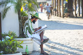 An artist paints the scene on the main boardwalk, Ilha Grande. More on Ilha Grande here.