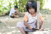 Young Girl Chopping Bamboo, Ubud, Bali