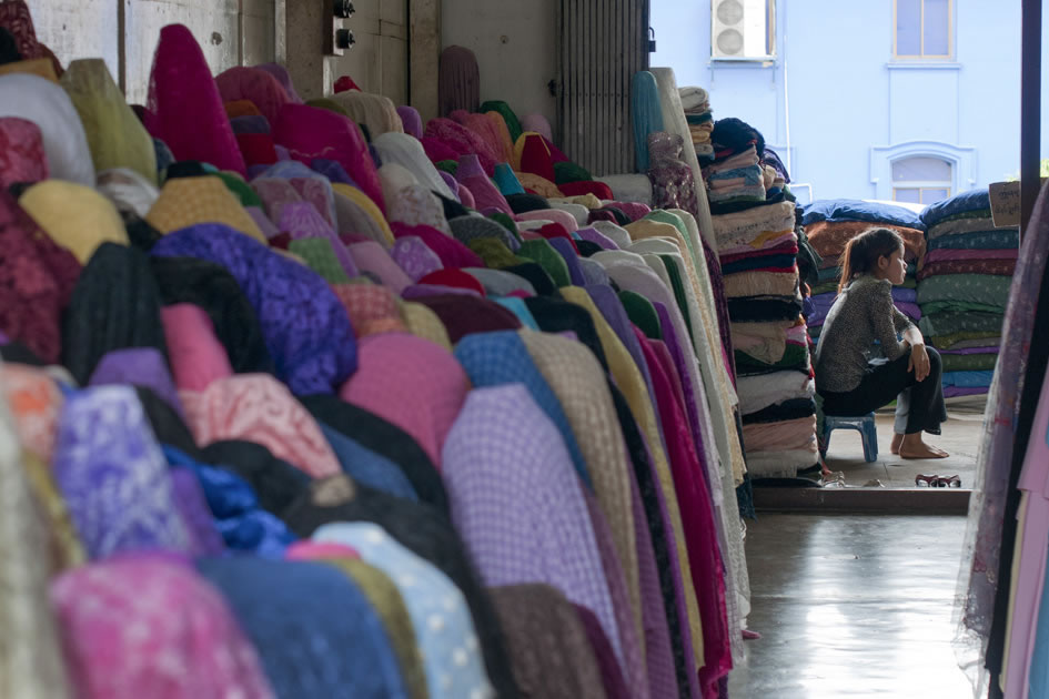 A quiet moment in a fabric shop at Bogyoke Market, Yangon