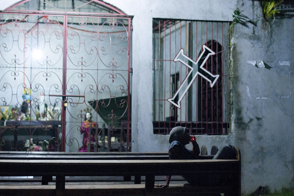 Smoking man outside a church, Bohol